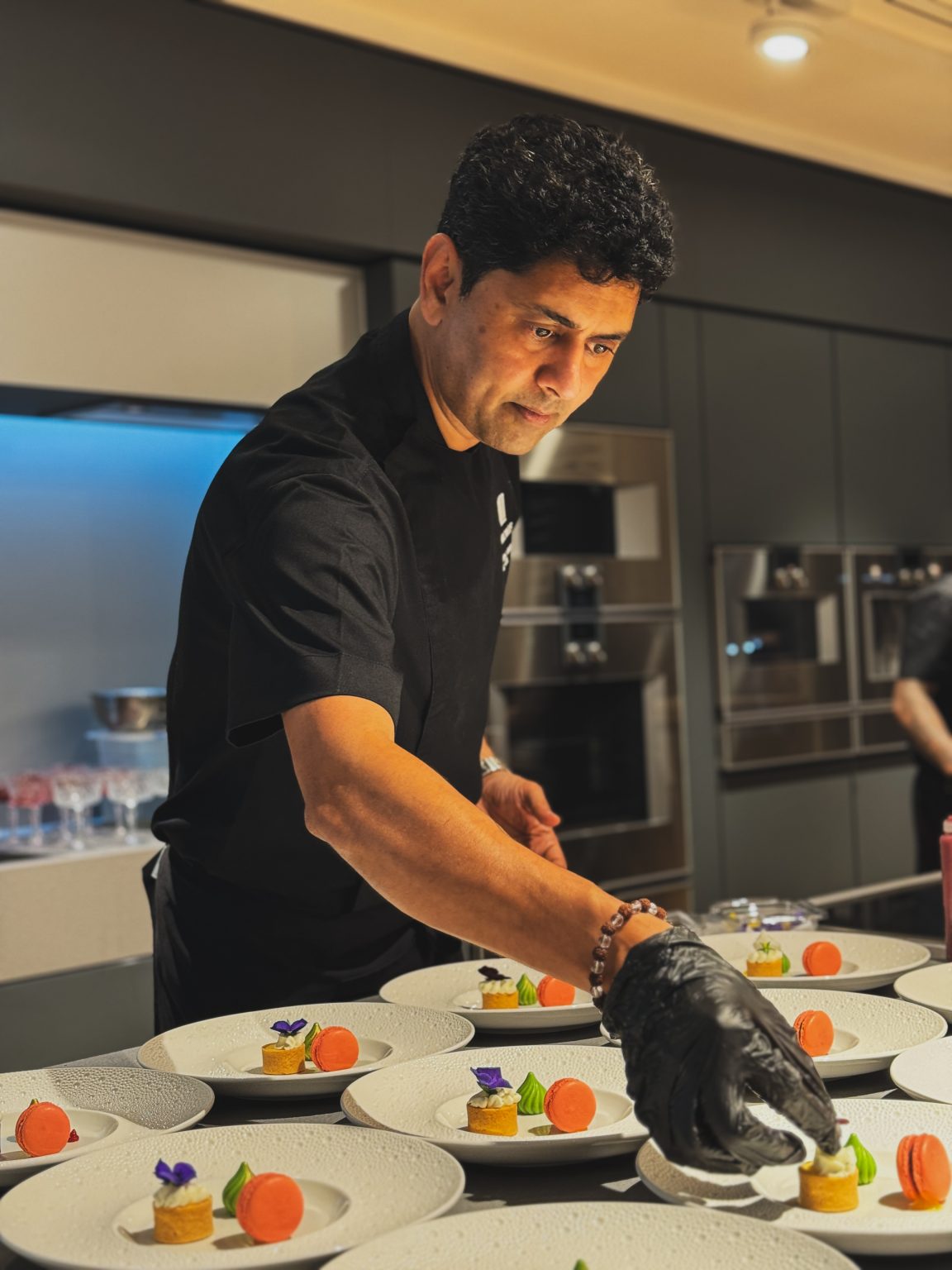 a chef preparing and plating desserts for a private home catering experience